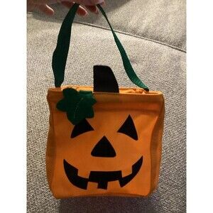 Thirty-one jack-o’-lantern pumpkin treat bag